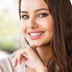 Woman with an attractive smile after cosmetic bonding.