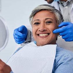 Woman smiling with a dental bridge in Calimesa