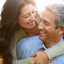 A man and woman smiling with greater confidence