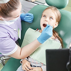 Little girl receiving a dental checkup