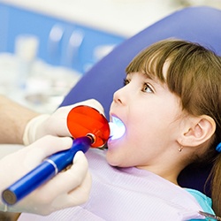 Young girl having a tooth-colored filling put in place