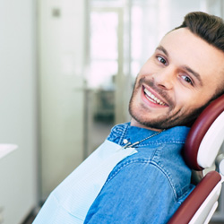 Calimesa patient smiling confidently with new veneers 