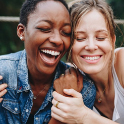 Calimesa veneers patient smiling with friend