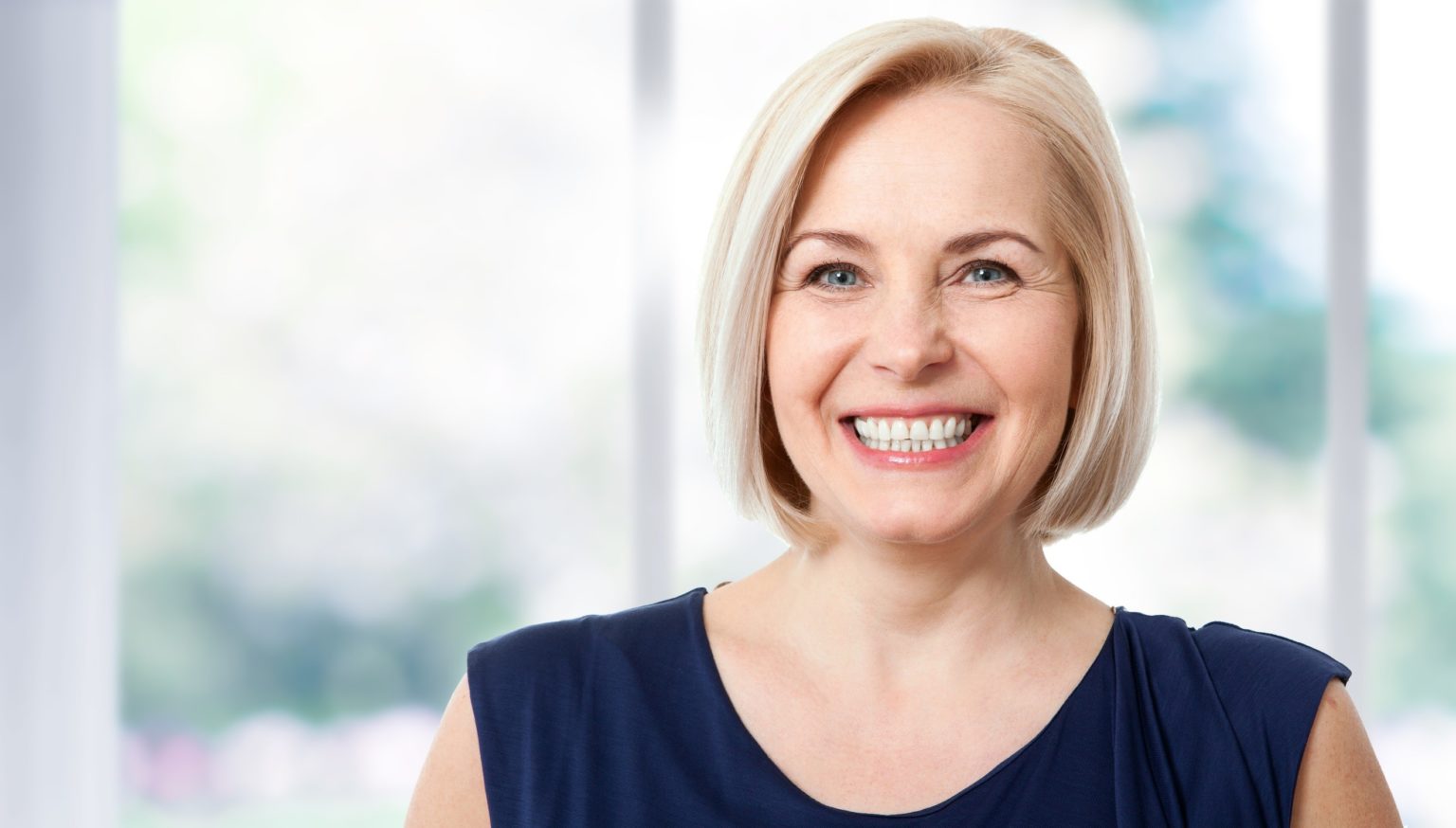 older woman smiling.