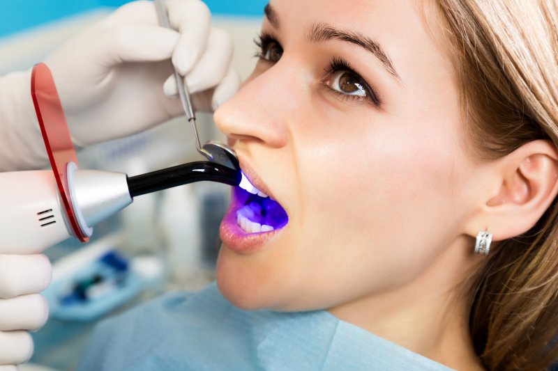 Woman undergoing a dental bonding procedure