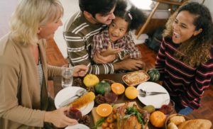 family of four enjoying a Thanksgiving meal