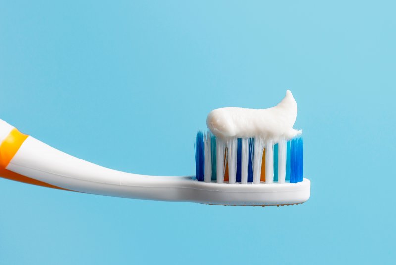 Close-up of toothbrush with white toothpaste