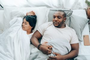 Couple in bed sleeping