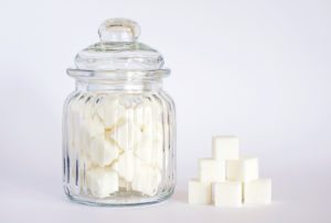 Sugar cubes and glass jar